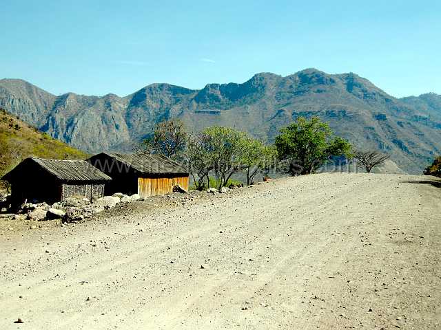 mesa_nayar4.JPG - The new highway had yet to be completed , the rough dirt road here had beed graded in anticipation of the paving crews.