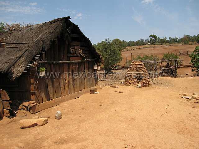 mesa_tepocha.JPG - This is a basic home in the Sierra Nayar. In the center of the picture is a bread oven.