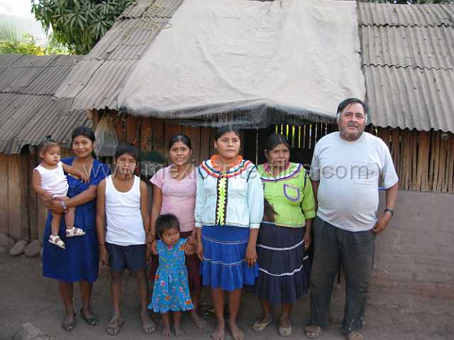 cora_family.JPG - Cora fammily , The two owmen in costume both wove Cora bags.