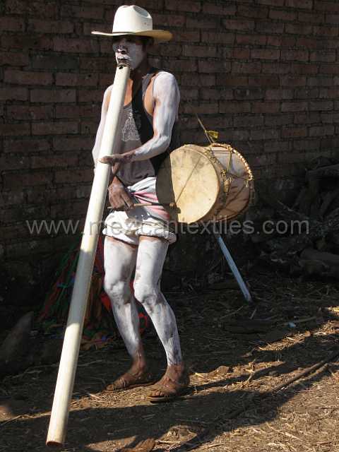 cora_men_05.JPG - A large flute made from a PVC tube.