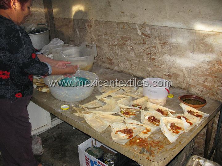 IMG_3055.JPG - Preparing tamales for sale.