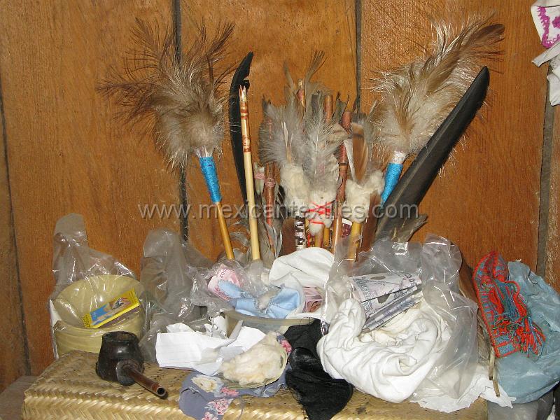 curandero_alter.JPG - The curanderos prayer arrows. She explained that each arrow was a person who she was curing. And the each one had significance for the sickness she was treating.
