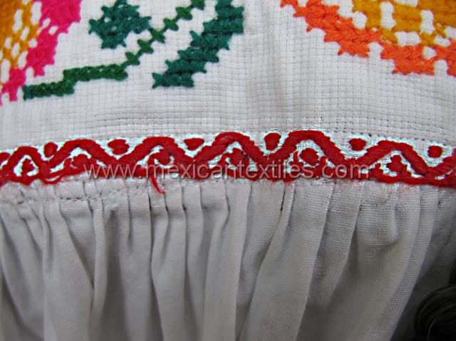 mazatlan_mazateca__37.JPG - In many cases all over Mexico , the " corazon" is made from store bought lace, in this example we can see the probable original form, at least hear in the remote Mazatlan de Villa Flores. Which is hand embroidered.