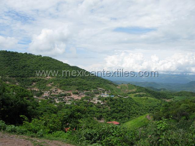 ahuehuepan_nahuatl06.JPG - Here is a view from the road into town of its setting.