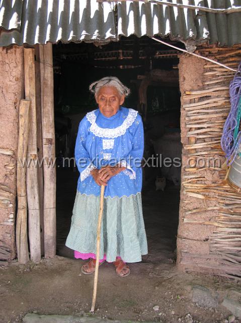 ahuehuepan_nahuatl18.JPG - To get up to meet her we had a steep rock wall to climb, when I realized she was nearly blind I wondered how she could make the trip to but food. A niece took her food and helped her out.