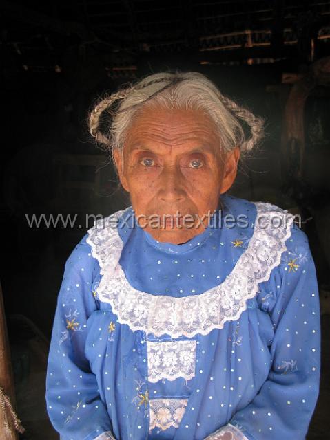 ahuehuepan_nahuatl20.JPG - The over blouse is made from store bought material and the lace is applied . The long sleeves are probably to protect from the sun as this region is generally very hot.