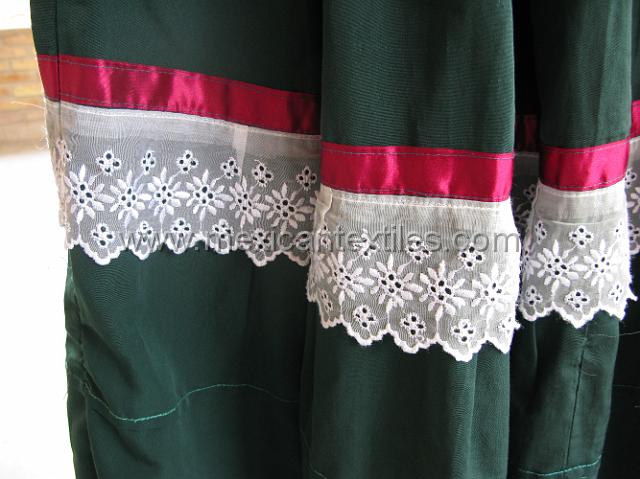 ahuelican_nahuatl12.JPG - A close up of the construction of the skirt, made with store bought material, lace and ribbon