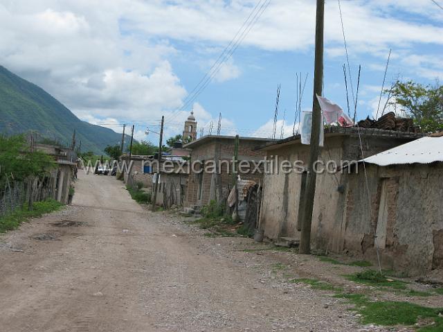nahuatl_ostiapan02.JPG - This is the main road into the vilage. The toen is electrified, telephone service is generally supplied at the local store , they use a loudspeaker to call for the person who recieves a call. There is also a small commercial commerce in paying for announcenets like Happy birthday or a festival or health reminders, town gatherings.