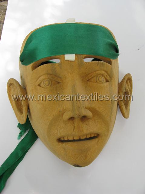 nahuatl_ostiapan06.JPG - A life like mask used in the dances. The owner told me that he actually learned to do this type of fine carving when he worked for a craftsman in Mexico City. My guide Pedro was very excited about this quality.
