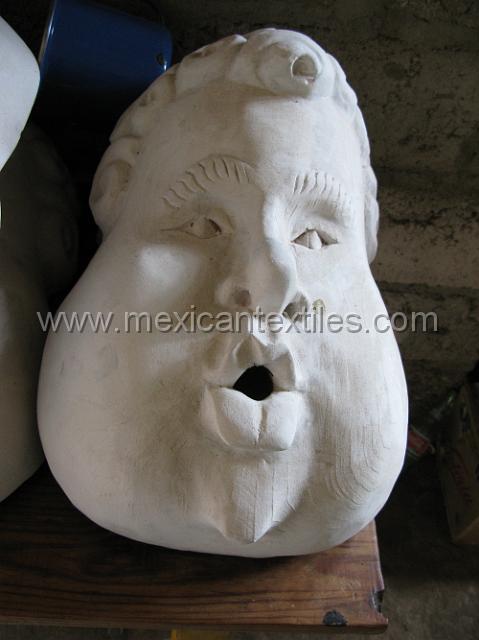 cozomatlan_nahua13.JPG - wood cherubs with primer on them.