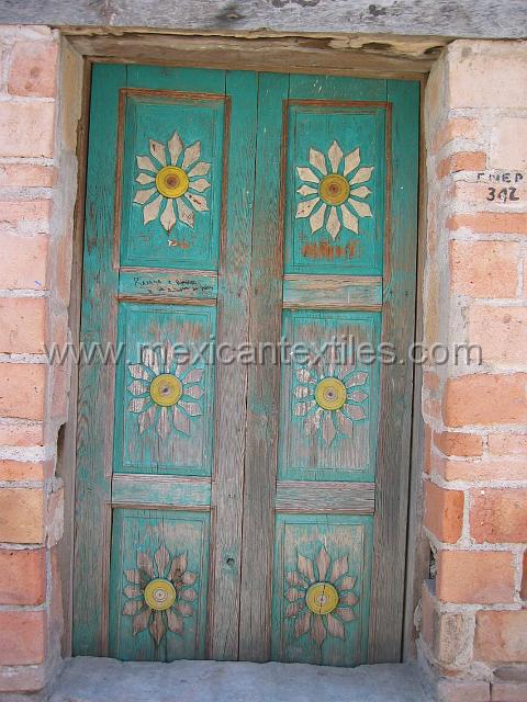nahua_xalitla08.JPG - Wood carving and mask making are still part of the culture here and these old doors are wonderful examples of the application to daily life of these artisans.