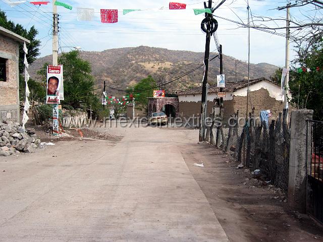 nahua_xalitla38.JPG - The main street entering into Xalitla in 2005 , down the road is the trusty Nissan Sentra that did most of the heavy lifting on these trips.
