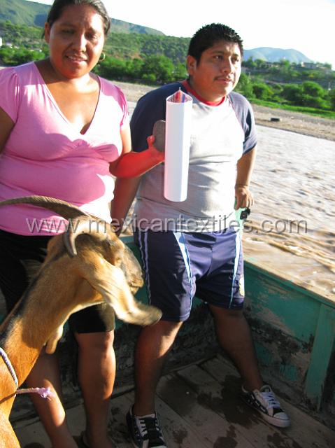 nahuatl_analco92.JPG - Pedro Martinez and his wife on the boat crossing to Analco. We had to share the boat with a goat who we kept a sharp eye on just in case it started to butt. Pedro is a master artist and his free hand drawing are amazing.