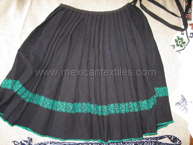 nahua_hueyapan_04.JPG - This is an older traditional wool skirt with embroidery. It is an evolution from a qrap skirt, I was told that it just took to long to put on a wrap skirt. It is pleated and then sewn into a skirt.