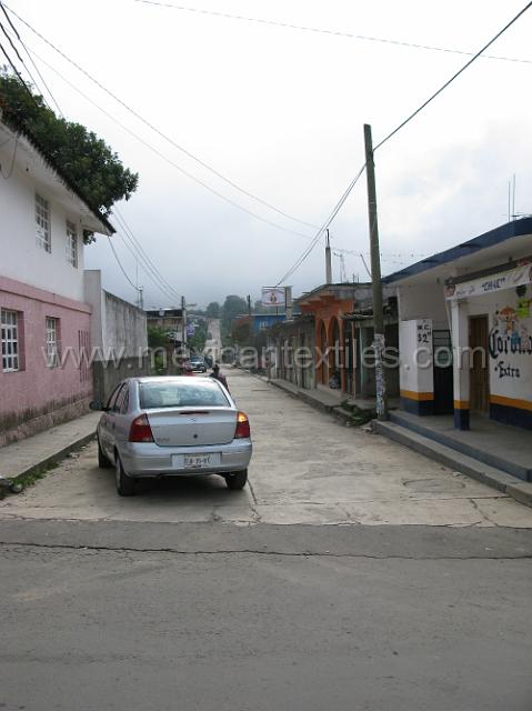 nahua_hueyapan_21.JPG - here you can see that the municipality is working hard , new pavement in the foreground and the road off into the distance is paved.