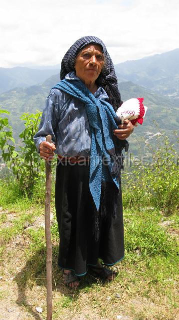 nahuatl_speaker_23.JPG - Magdelena Vincente Juarez , we encountered her walking down the hill to Chiometepec. She is wearing a traditional black wrap skirt, backstrap woven belt and a blouse cut in the traditional fashion, she is also wearing a reboso on her head instead of a quechquemitl.