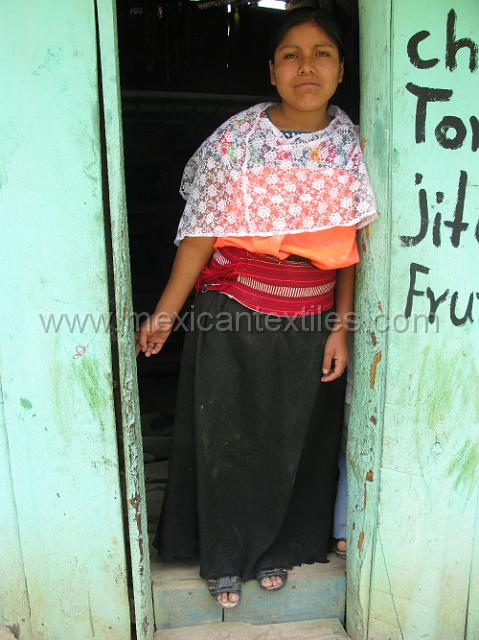 bueaty_totonaca_tonalisco.JPG - Marta close up with her embroidered blouse with a orange body. Here in the town few blouses were white. She is also wearing the wide Totonacan belt and a black wrap skirt and a lace quechquemitl.