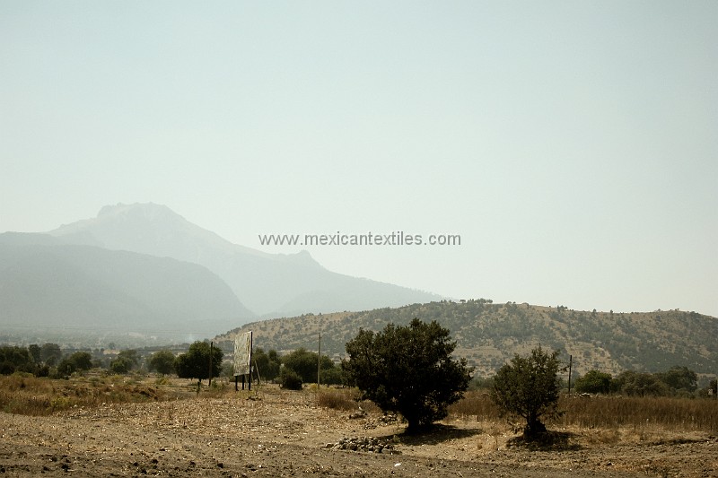 Otomi_Ixtenco_24.jpg - On the right is a small shield tpye volcano or vent, It has 7 craters inside and plays an important role in the cosmonvision of the Otomi of Ixtenco. It is said to be the place of refuge during the great floods which precluded the formation of the current era. It is called Cerro Xalapaxco ( Nahuatl) and MamA' Trehe in Otomi.