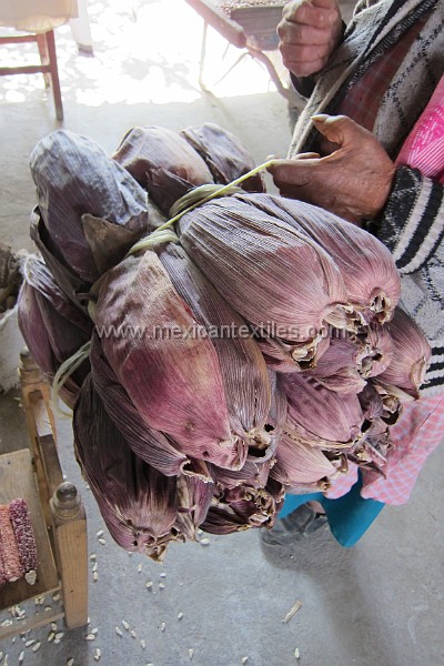 Otomi_Ixtenco_58.jpg - The corn husks are used to make tamales, what is interesting herre is that they will color the tamals purple. They showed my the corn and it was white but the cobb was also purple.