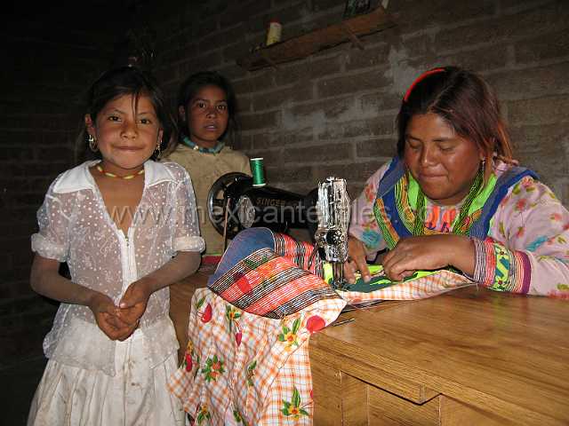 cora_pastor_04.JPG - Cora seamstress working on a Cora skirt. I was able to buy a complete costume from her.