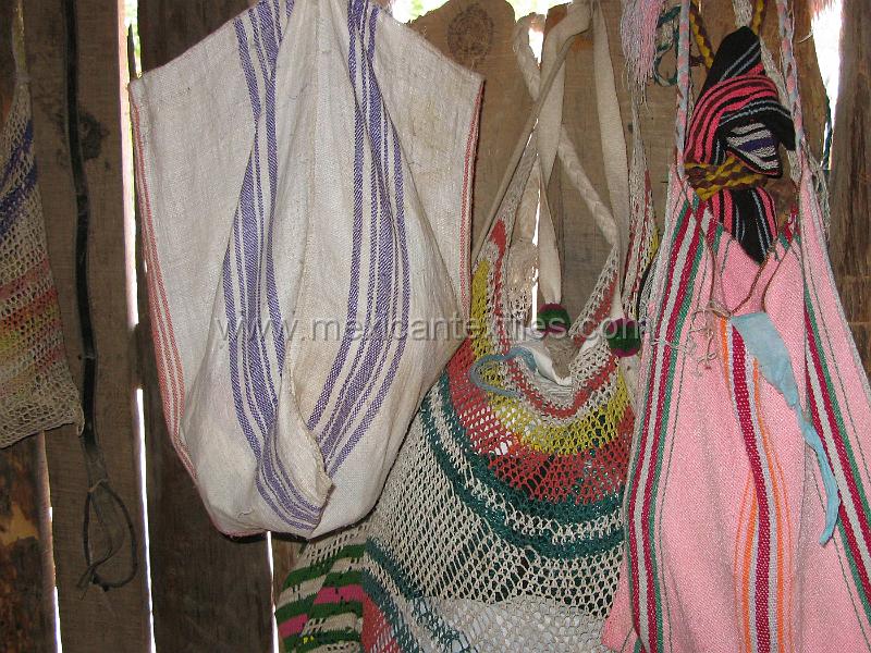 tepehuano_bags_02.JPG - Documentation of tepehuano indigenous textiles from Huajicori, Nayarit, Mexico. Documentation of tepehuano indigenous textiles from Huajicori, Nayarit, Mexico. The homes are filled with bags hanging like wonderful treasures. Here are some examples of woven and net bags.